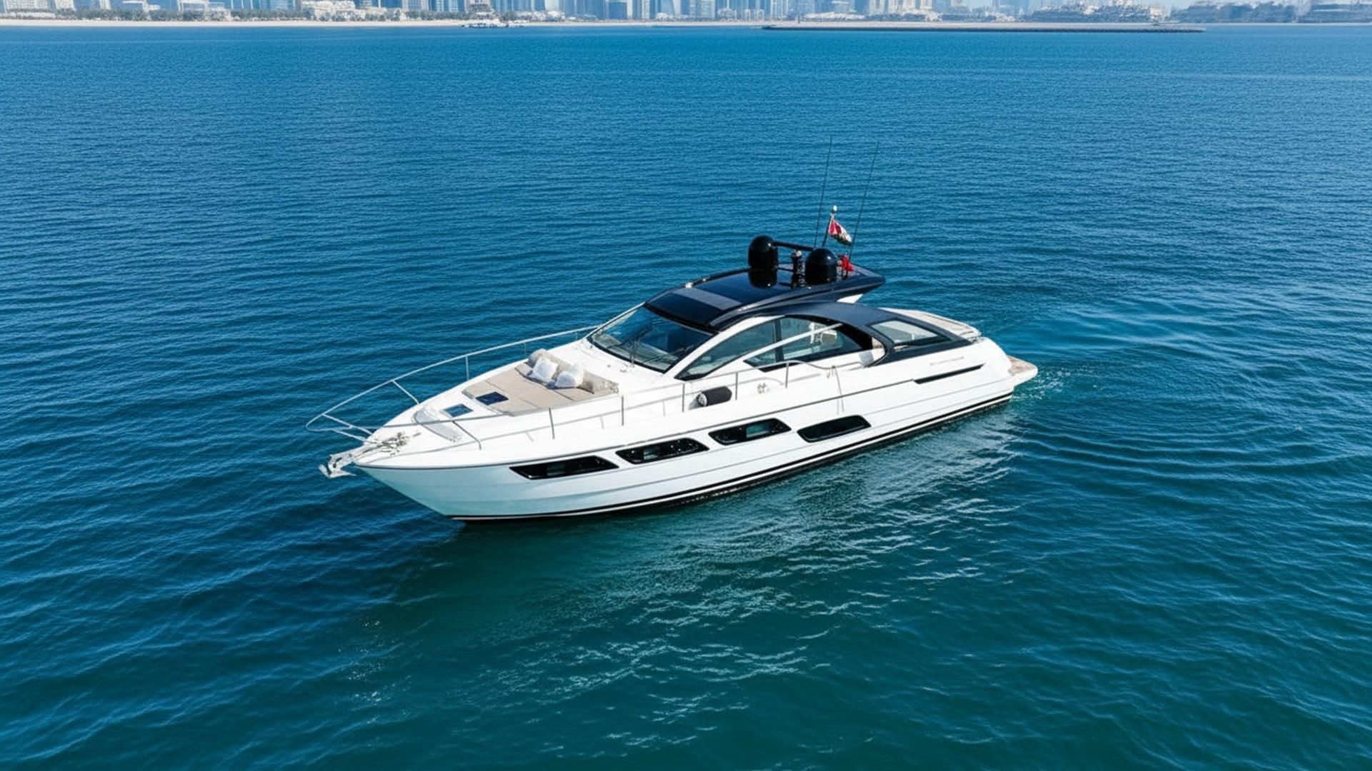 Aerial view of Emerald Breeze 52 ft cruising Dubai Marina