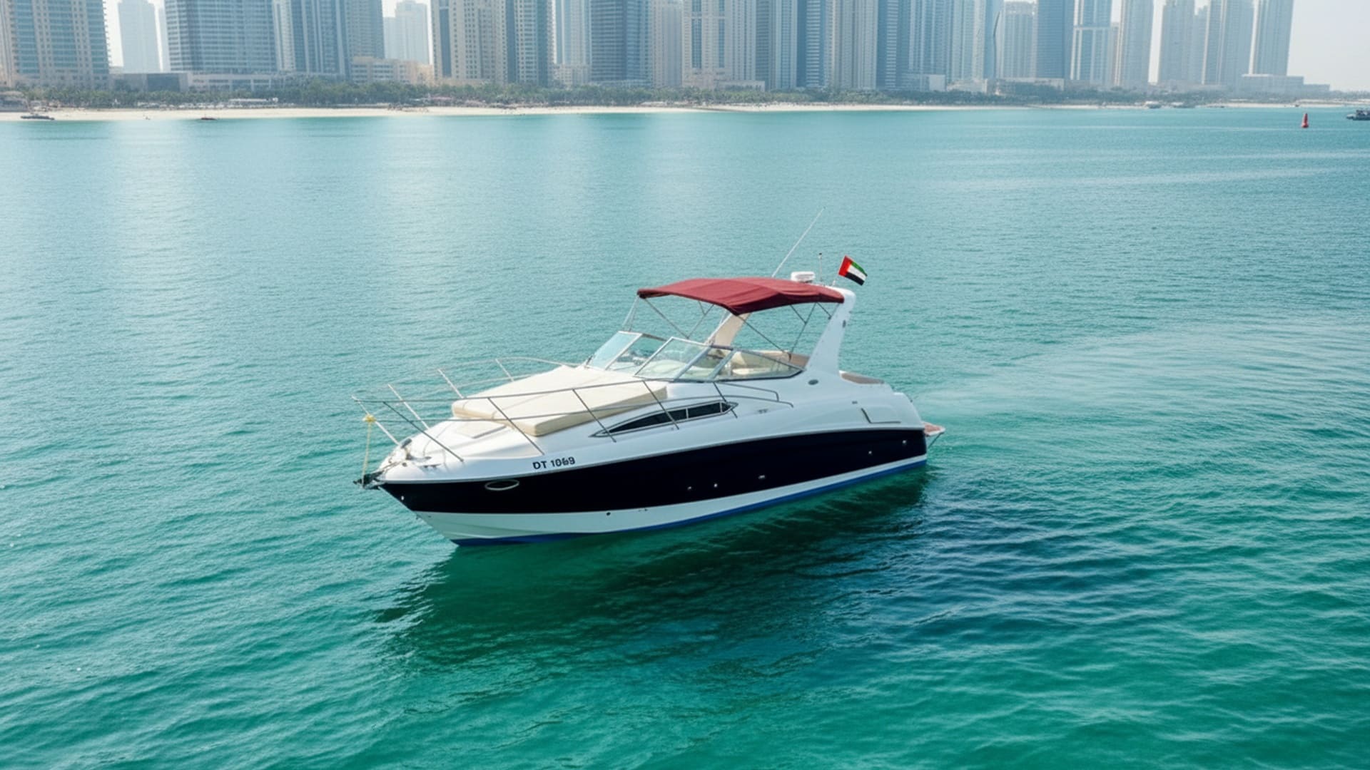 Emerald Wind 33 ft yacht aerial view, Dubai skyline